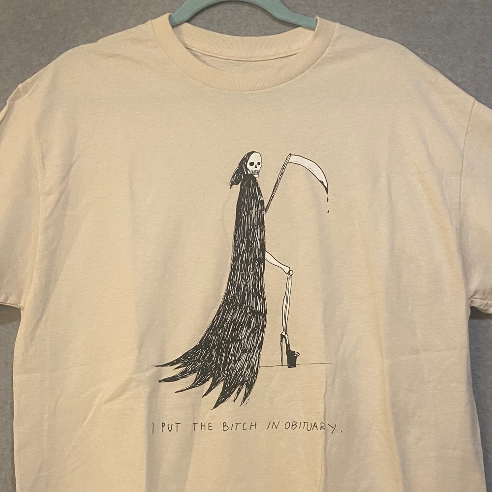 Edgy Cream Graphic Tee with Grim Reaper Design